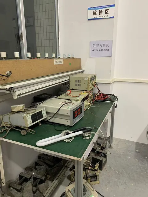 Inspection area with adhesion test station