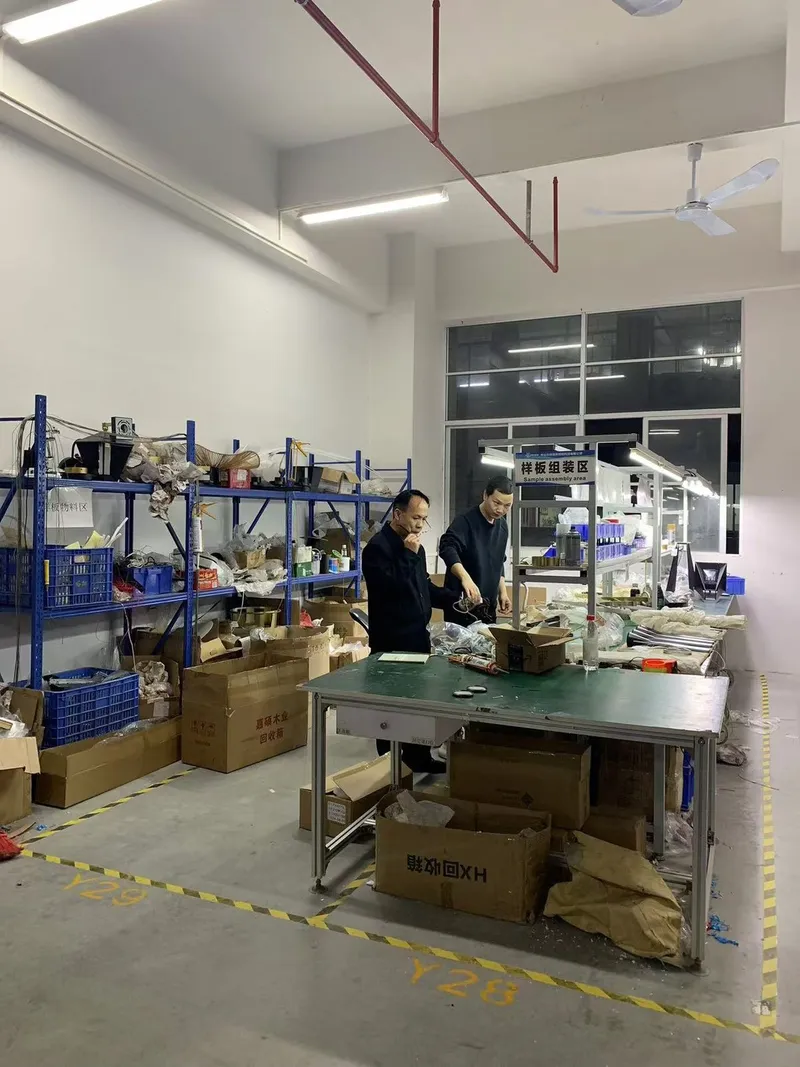 Sample assembly area with engineers building a pre-production lighting sample