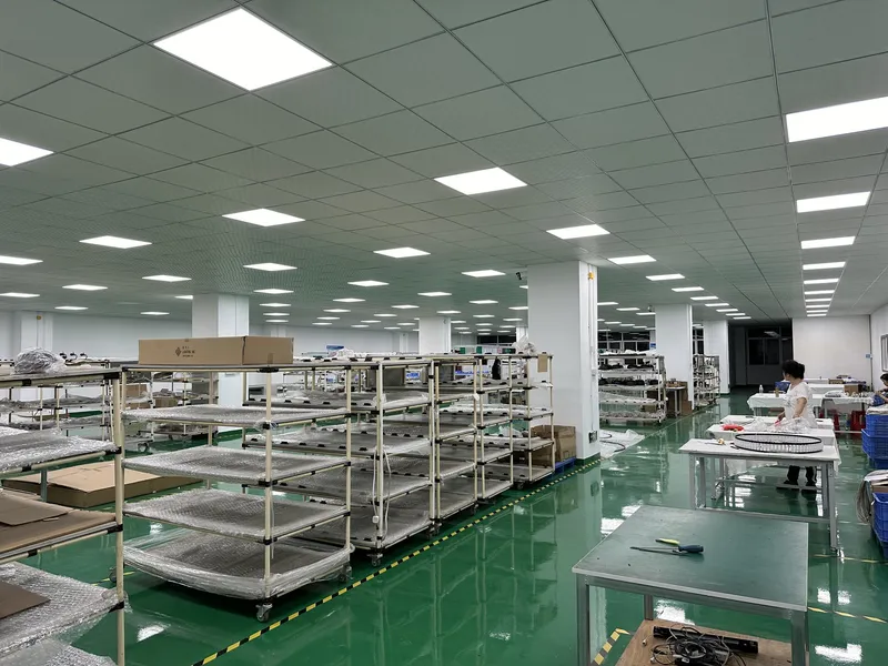 Parts racking and assembly benches inside the CORONA ZHONGSHAN LIGHTING factory